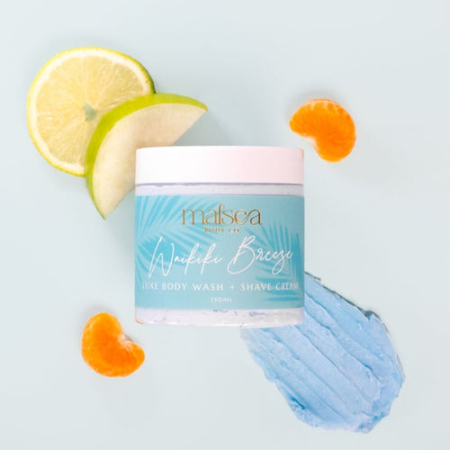 Jar of Malsea body wash with lemon and orange slices on a light blue background. Scent Waikiki Breeze available at Stylecom.nz 