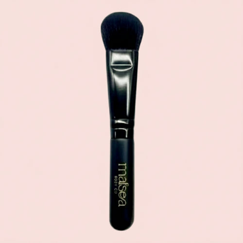 Matcha mask brush with black handle and soft bristle head on a light pink background. Makes matcha mask application easier and less messy. Available at Stylecom.nz 
