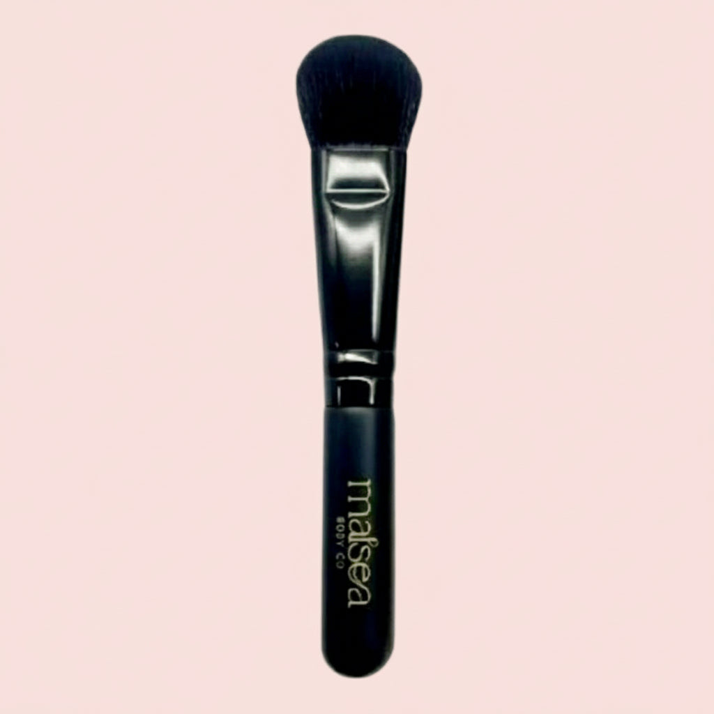 Matcha mask brush with black handle and soft bristle head on a light pink background. Makes matcha mask application easier and less messy. Available at Stylecom.nz 