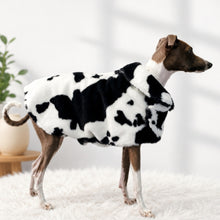 Load image into Gallery viewer, Italian Greyhound Dog standing side on in the Posh Dog Coat from STYLECOM.NZ. Black + White Cow Print in faux mink outer / white sherpa inner for luxurious, cosy warmth. 